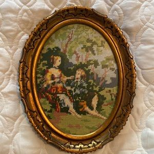 Oval Vintage Needlepoint canvas in original frame.